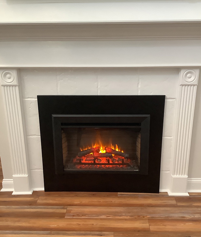 Simplifire electric Insert installed into factory built fireplace